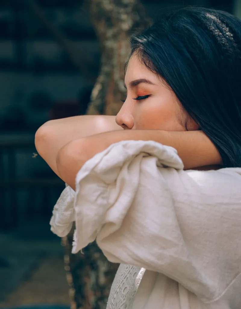 Woman resting with her eyes closed